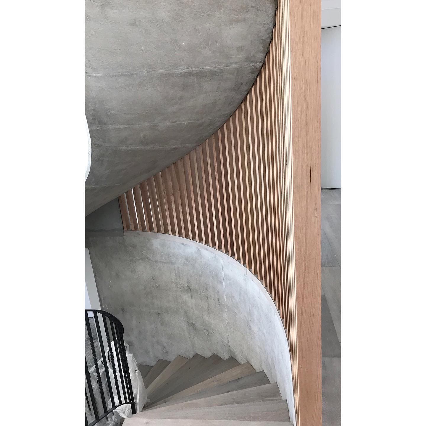 Concrete and timber spiral stairs